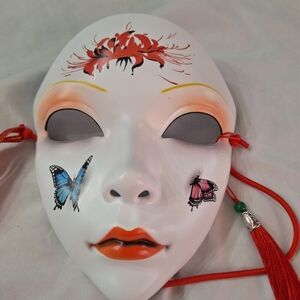 Decorative White Mask with Red and Blue Accents